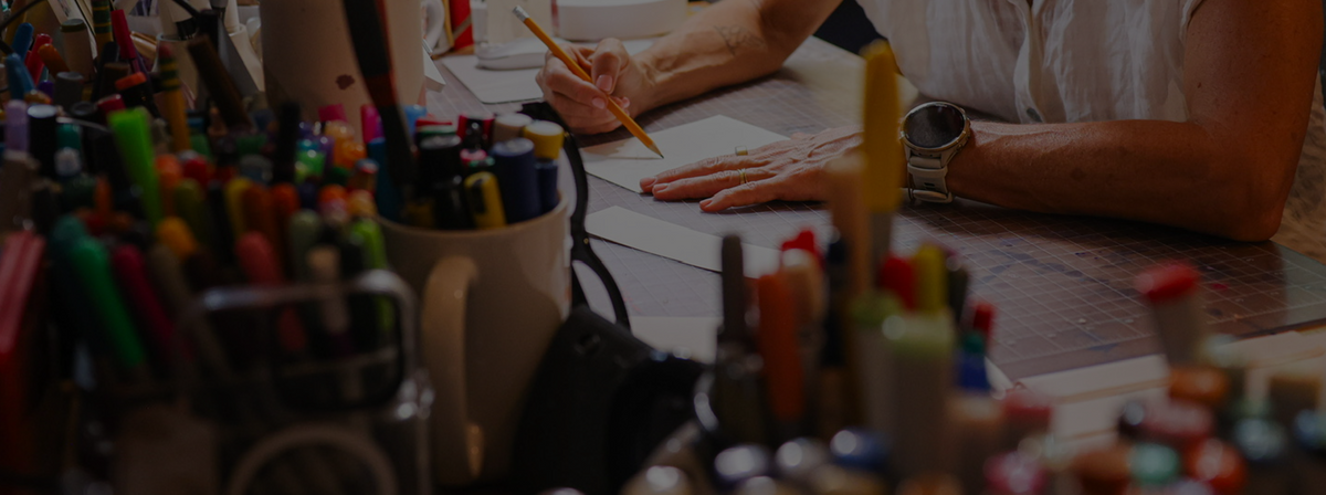 Jess sketching at her studio desk